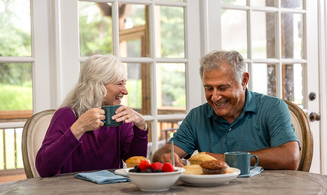Elderly couple talking and enjoying brunch together