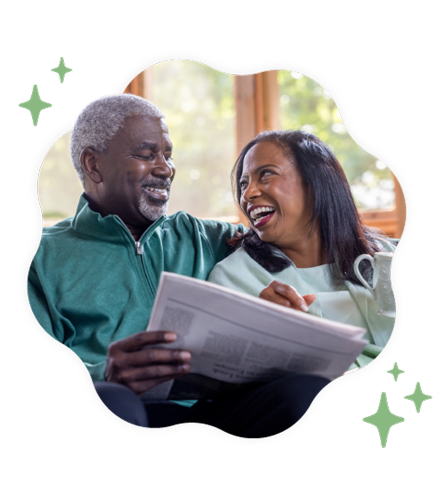 A smiling older couple looking at each other while relaxing with a newspaper and coffee, framed in a wavy shape with green stars.
